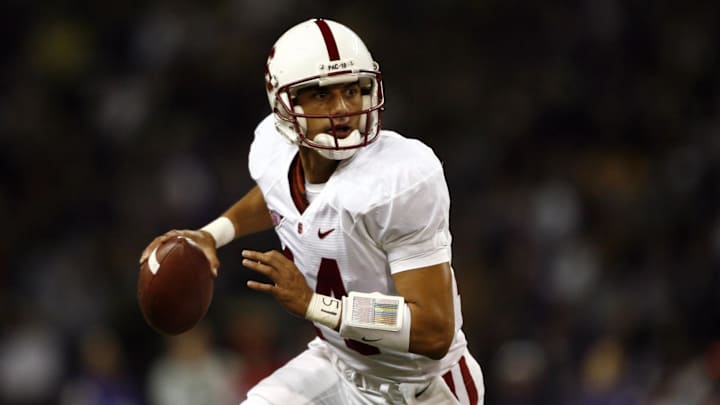 Sept 27, 2008; Seattle, WA, USA; Stanford Cardinal quarterback Tavita Pritchard (14) scrambles out of the pocket against the Washington Huskies during the first half at Husky Stadium. Stanford defeated Washington, 35-28. Mandatory Credit: Joe Nicholson-Imagn Images