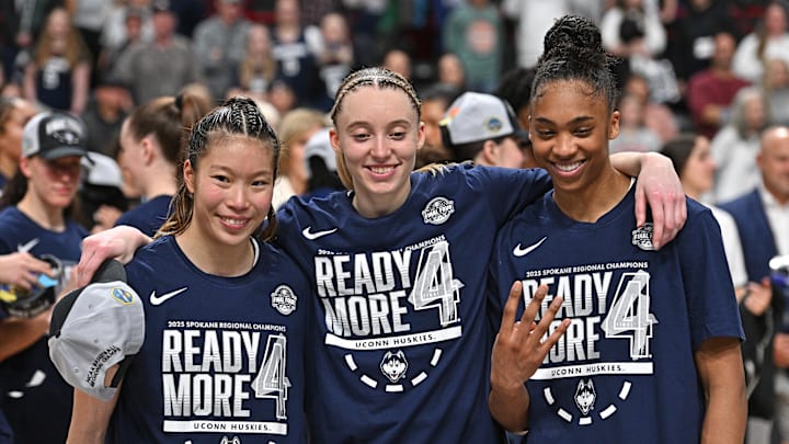 UConn Huskies guard Chen, Bueckers and forward Griffin pose for a photo after a Elite Eight NCAA Tournament basketball game against the USC Trojans at Spokane Arena. 