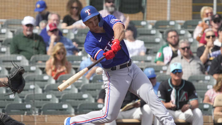 Feb 27, 2024; Salt River Pima-Maricopa, Arizona, USA; Texas Rangers left fielder Wyatt Langford (82)
