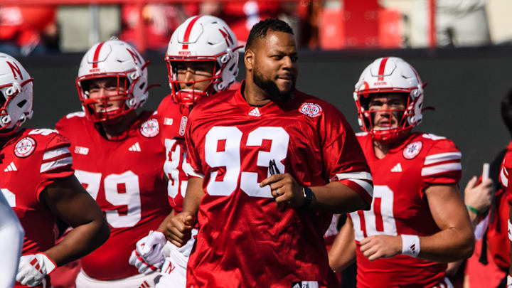 Former Nebraska football player Ndamukong Suh (93) runs the Tunnel Walk for homecoming weekend against Rutgers.