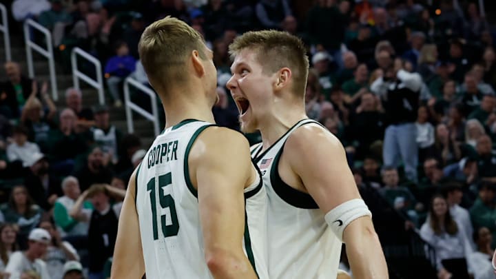 Michigan State forward Jaxon Kohler, right, screams in celebration to center Carson Cooper, left, after Cooper converted an alley-oop against the Detroit Mercy Titans at the Breslin Center on Friday, Nov. 21, 2025.