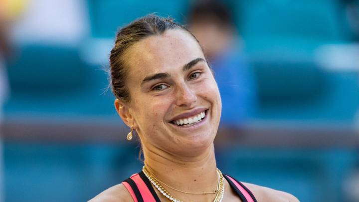 Aryna Sabalenka smiles after winning a match Aryna Sabalenka smiles after winning a match