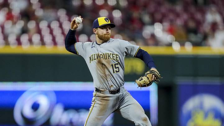 Apr 9, 2024; Cincinnati, Ohio, USA; Milwaukee Brewers third baseman Oliver Dunn (15) throws to first to get Cincinnati Reds catcher Tyler Stephenson (not pictured) out in the fifth inning at Great American Ball Park. Mandatory Credit: Katie Stratman-Imagn Images