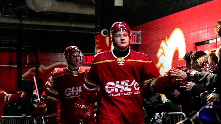 CALGARY, CANADA - NOVEMBER 25: Egor Shilov #9 of Team CHL and teammates great fans as they walk to the ice during warmups before the CHL USA Prospects Challenge at the Scotiabank Saddledome on November 25, 2025 in Calgary, Canada. (Photo by Leah Hennel/Getty Images)