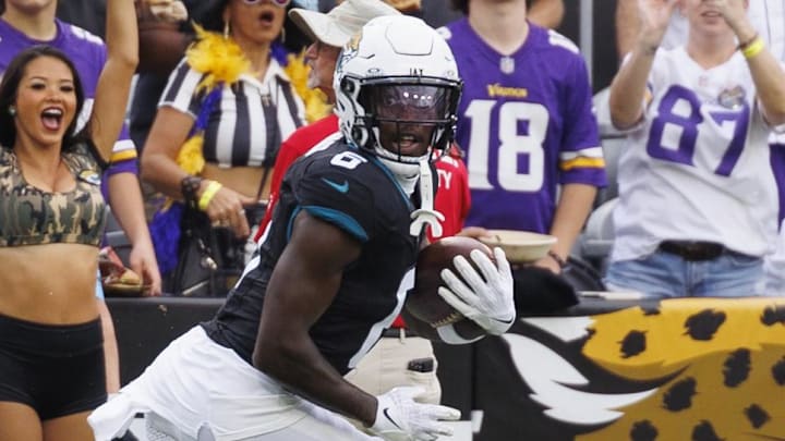 Nov 10, 2024; Jacksonville, Florida, USA; Jacksonville Jaguars safety Darnell Savage (6) makes an interception catch against the Minnesota Vikings during the third quarter at EverBank Stadium. Mandatory Credit: Morgan Tencza-Imagn Images