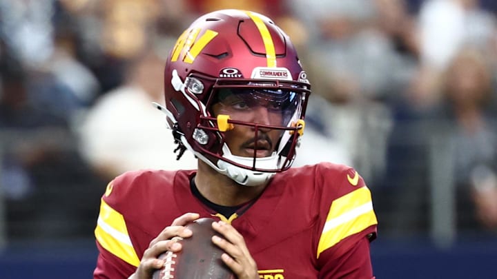 Oct 19, 2025; Arlington, Texas, USA; Washington Commanders quarterback Jayden Daniels (5) looks to pass the ball against the Dallas Cowboys during the first quarter of the game at AT&T Stadium. Mandatory Credit: Kevin Jairaj-Imagn Images