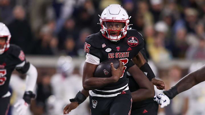 Nov 21, 2024; Atlanta, Georgia, USA; North Carolina State Wolfpack quarterback CJ Bailey (16) runs for a touchdown against the Georgia Tech Yellow Jackets in the fourth quarter at Bobby Dodd Stadium at Hyundai Field. Mandatory Credit: Brett Davis-Imagn Images Nov 21, 2024; Atlanta, Georgia, USA; North Carolina State Wolfpack quarterback CJ Bailey (16) runs for a touchdown against the Georgia Tech Yellow Jackets in the fourth quarter at Bobby Dodd Stadium at Hyundai Field. Mandatory Credit: Brett Davis-Imagn Images