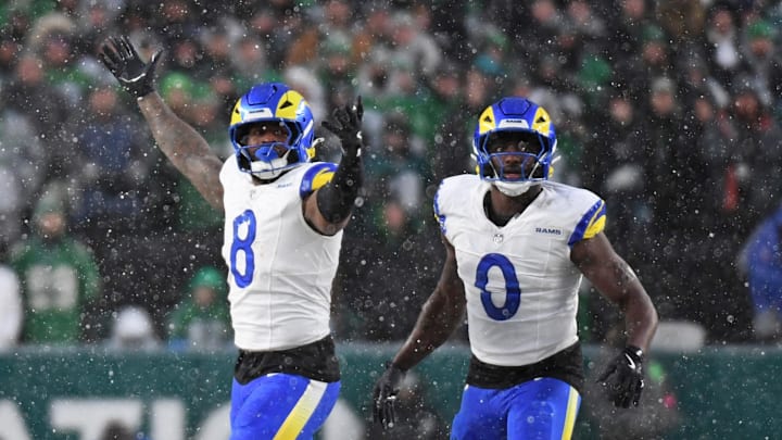 Jan 19, 2025; Philadelphia, Pennsylvania, USA; Los Angeles Rams linebacker Jared Verse (8) and linebacker Byron Young (0) celebrate a sack against the Philadelphia Eagles in a 2025 NFC divisional round game at Lincoln Financial Field. Mandatory Credit: Eric Hartline-Imagn Images