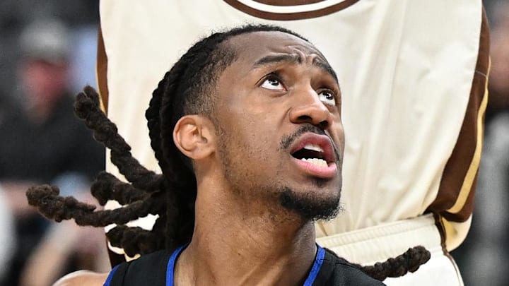Mar 20, 2026; Detroit, Michigan, USA;  Detroit Pistons guard Daniss Jenkins (24) drives to the basket against Golden State Warriors forward Gui Santos (15) in the first half at Little Caesars Arena. Mandatory Credit: Lon Horwedel-Imagn Images