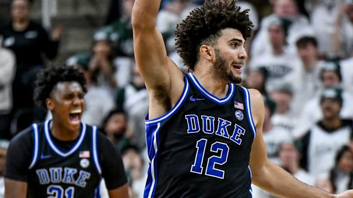 Duke's Cameron Boozer, center, celebrates after teammate Caleb Foster's 3-pointer against Michigan State during the second half on Saturday, Dec. 6, 2025, at the Breslin Center in East Lansing.