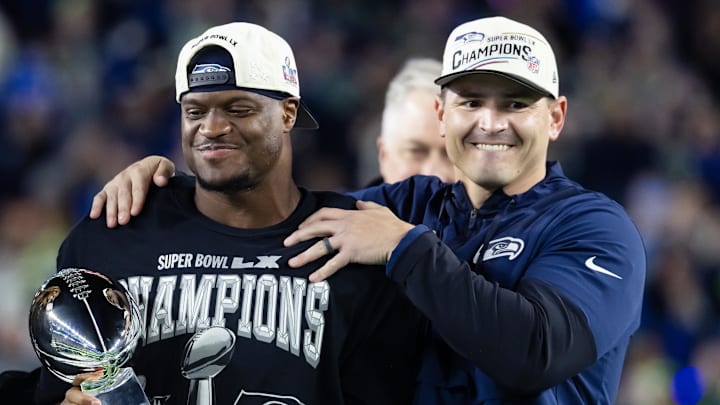 Feb 8, 2026; Santa Clara, CA, USA; Seattle Seahawks head coach Mike MacDonald and running back Kenneth Walker III (9) celebrate with the Vince Lombardi trophy after defeating the New England Patriots in Super Bowl LX at Levi's Stadium.