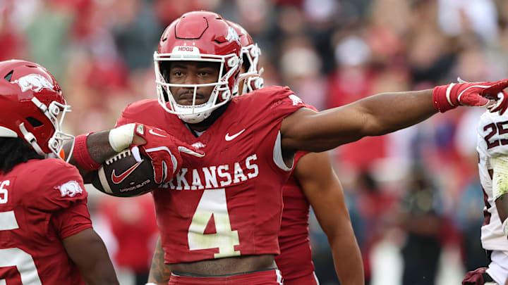 Oct 18, 2025; Fayetteville, Arkansas, USA; Arkansas Razorbacks running back Mike Washington Jr (4) celebrates after rushing for a first down in the second quarter against the Texas A&M Aggies at Donald W. Reynolds Razorback Stadium. Mandatory Credit: Nelson Chenault-Imagn Images