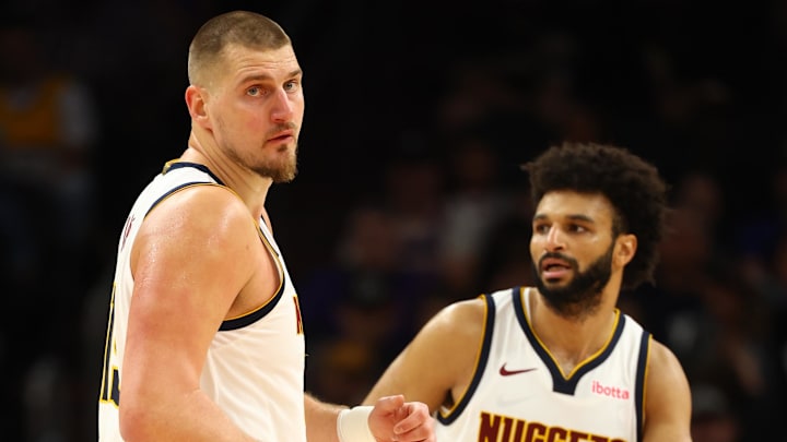Nov 29, 2025; Phoenix, Arizona, USA; Denver Nuggets center Nikola Jokic (15) and guard Jamal Murray (27) against the Phoenix Suns at the Mortgage Matchup Center. Mandatory Credit: Mark J. Rebilas-Imagn Images Nov 29, 2025; Phoenix, Arizona, USA; Denver Nuggets center Nikola Jokic (15) and guard Jamal Murray (27) against the Phoenix Suns at the Mortgage Matchup Center. Mandatory Credit: Mark J. Rebilas-Imagn Images