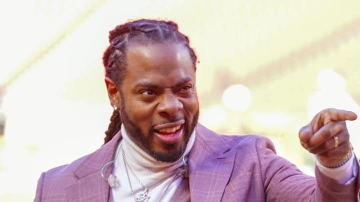 Commentator Richard Sherman signals to fans Commentator Richard Sherman signals to fans