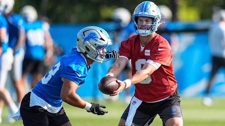Detroit Lions quarterback Kyle Allen (8) hands the ball to running back Sione Vaki (33) at practice during training camp at Meijer Performance Center in Allen Park on Monday, July 21, 2025. Detroit Lions quarterback Kyle Allen (8) hands the ball to running back Sione Vaki (33) at practice during training camp at Meijer Performance Center in Allen Park on Monday, July 21, 2025.