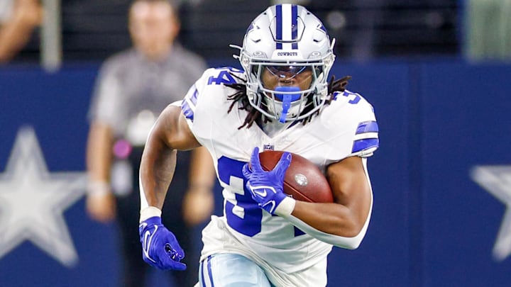 Dallas Cowboys running back Jaydon Blue (34) carries the ball during the fourth quarter against the Atlanta Falcons at AT&T Stadium.