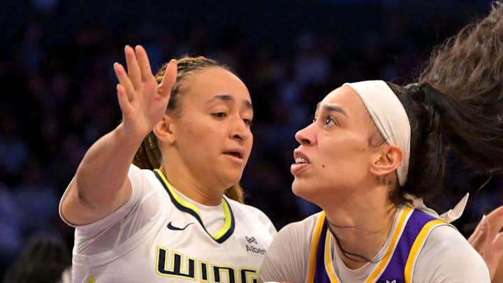 Los Angeles Sparks forward Dearica Hamby drives past Dallas Wings guard Haley Jones.