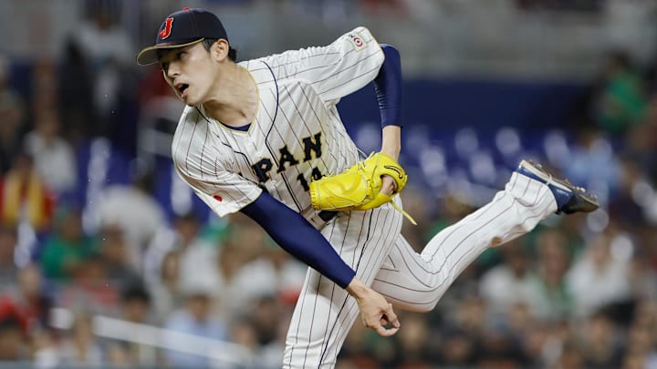 Mar 20, 2023; Miami, Florida, USA; Japan starting pitcher Roki Sasaki (14) delivers a pitch during the first inning against Mexico at LoanDepot Park