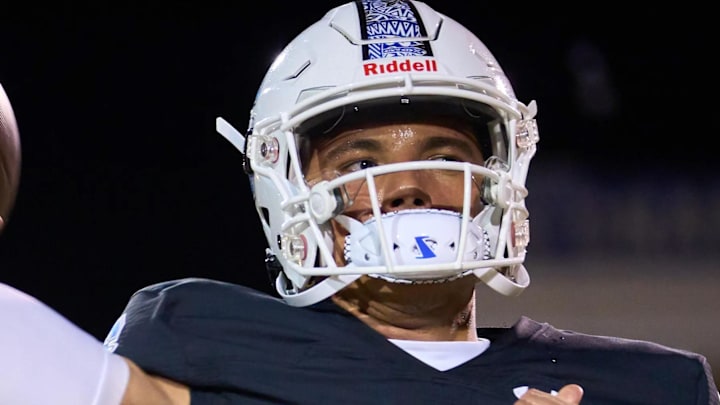 Chandler Wolves quarterback Dylan Raiola (1) warms up