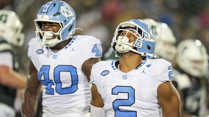 Sep 6, 2025; Charlotte, North Carolina, USA; North Carolina Tar Heels linebacker Andrew Simpson (2) celebtates his sack along with linebacker Tyler Thompson (40) during the second half against the Charlotte 49ers at Jerry Richardson Stadium. Mandatory Credit: Jim Dedmon-Imagn Images