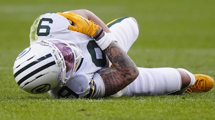 Green Bay Packers receiver Christian Watson lies on the field following an injury during the third quarter against the Broncos. Green Bay Packers receiver Christian Watson lies on the field following an injury during the third quarter against the Broncos.