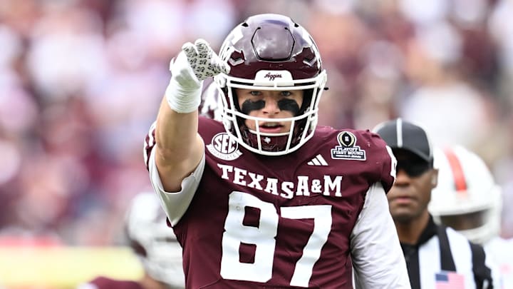 Dec 20, 2025; College Station, TX, USA; Texas A&M Aggies tight end Nate Boerkircher (87) celebrates a first down against the Miami Hurricanes during first quarter of the first round game of the CFP National Playoff at Kyle Field. 