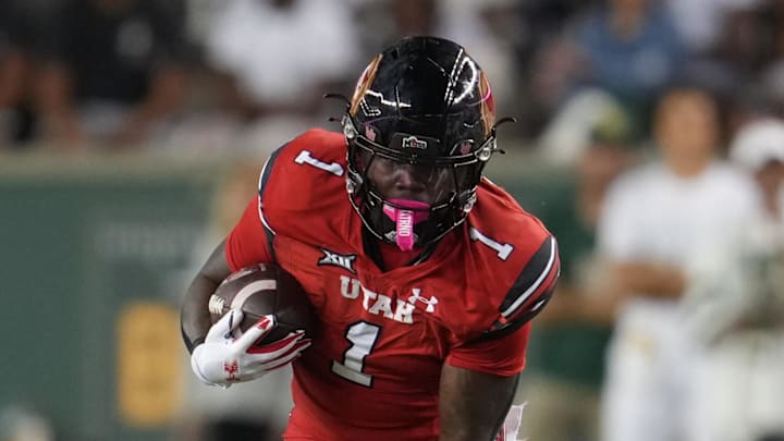 Utah Utes running back Wayshawn Parker (1) carries the ball against the Baylor Bears during the first half at McLane Stadium.