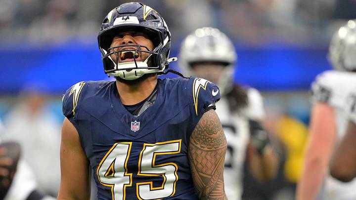 Nov 30, 2025; Inglewood, California, USA; Los Angeles Chargers linebacker Tuli Tuipulotu (45) reacts after a sack against the Las Vegas Raiders during the second half at SoFi Stadium. Mandatory Credit: Jayne Kamin-Oncea-Imagn Images