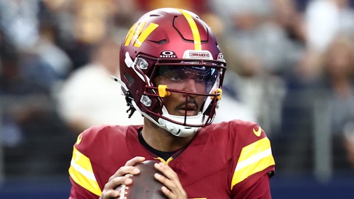 Oct 19, 2025; Arlington, Texas, USA; Washington Commanders quarterback Jayden Daniels (5) looks to pass the ball against the Dallas Cowboys during the first quarter of the game at AT&T Stadium. Mandatory Credit: Kevin Jairaj-Imagn Images