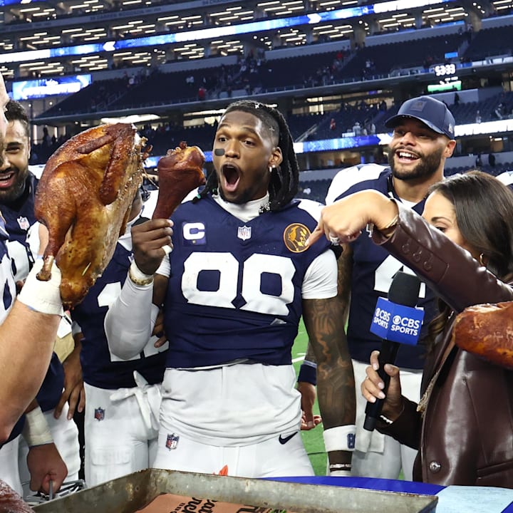 Dallas Cowboys wide receiver CeeDee Lamb celebrates with a turkey after the game against the Kansas City Chiefs 