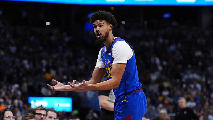 Mar 1, 2026; Denver, Colorado, USA; Denver Nuggets forward Cameron Johnson (23) reacts to a foul in the first quarter against the Minnesota Timberwolves at Ball Arena. Mandatory Credit: Ron Chenoy-Imagn Images