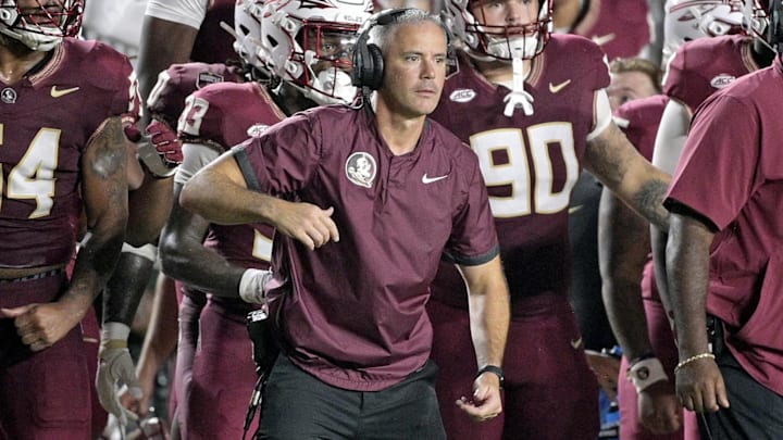 Sep 21, 2024; Tallahassee, Florida, USA; Florida State Seminoles head coach Mike Norvell and his team watch the time tick off of the clock during the fourth quarter against the California Golden Bears at Doak S. Campbell Stadium. Mandatory Credit: Melina Myers-Imagn Images