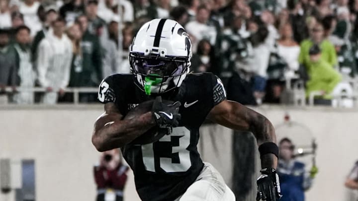 Sep 6, 2025; East Lansing, Michigan, USA; Michigan State wide receiver Chrishon McCray (13) runs the ball in the fourth quarter at Spartan Stadium. Mandatory Credit: Brendan Mullin-Imagn Images Sep 6, 2025; East Lansing, Michigan, USA; Michigan State wide receiver Chrishon McCray (13) runs the ball in the fourth quarter at Spartan Stadium. Mandatory Credit: Brendan Mullin-Imagn Images