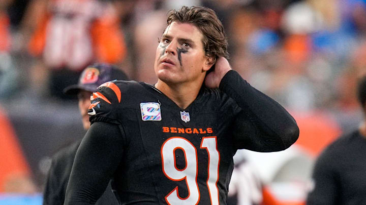 Cincinnati Bengals defensive end Trey Hendrickson (91) watches a replay as the Detroit Lions celebrate a touchdown in the fourth quarter of the NFL Week 5 game between the Cincinnati Bengals and the Detroit Lions at Paycor Stadium in downtown Cincinnati on Sunday, Oct. 5, 2025. The Bengals continued a losing streak, falling 37-24 to the Lions. Cincinnati Bengals defensive end Trey Hendrickson (91) watches a replay as the Detroit Lions celebrate a touchdown in the fourth quarter of the NFL Week 5 game between the Cincinnati Bengals and the Detroit Lions at Paycor Stadium in downtown Cincinnati on Sunday, Oct. 5, 2025. The Bengals continued a losing streak, falling 37-24 to the Lions.