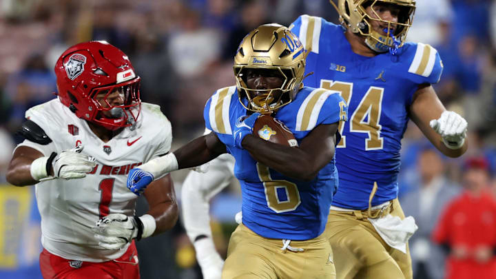 Sep 12, 2025; Pasadena, California, USA; UCLA Bruins running back Anthony Woods (6) runs with the ball during the second quarter against the New Mexico Lobos at Rose Bowl. Mandatory Credit: Kiyoshi Mio-Imagn Images Sep 12, 2025; Pasadena, California, USA; UCLA Bruins running back Anthony Woods (6) runs with the ball during the second quarter against the New Mexico Lobos at Rose Bowl. Mandatory Credit: Kiyoshi Mio-Imagn Images
