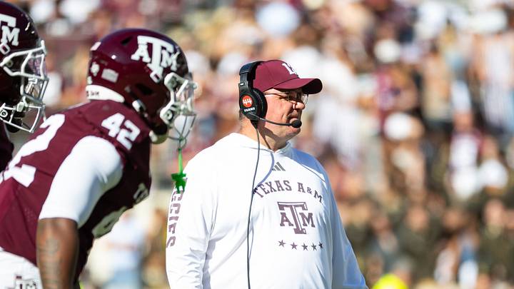 Nov 22, 2025; College Station, Texas, USA; Texas A&M Aggies head coach Mike Elko on the field in the second half of a game against the Samford Bulldogs at Kyle Field. Mandatory Credit: Joseph Buvid-Imagn Images Nov 22, 2025; College Station, Texas, USA; Texas A&M Aggies head coach Mike Elko on the field in the second half of a game against the Samford Bulldogs at Kyle Field. Mandatory Credit: Joseph Buvid-Imagn Images