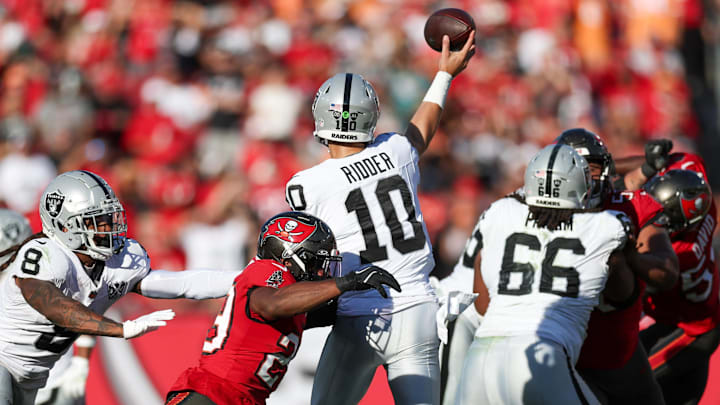 Dec 8, 2024; Tampa, Florida, USA; Las Vegas Raiders quarterback Desmond Ridder (10) is pressured by Tampa Bay Buccaneers safety Christian Izien (29) in the fourth quarter at Raymond James Stadium. Mandatory Credit: Nathan Ray Seebeck-Imagn Images Dec 8, 2024; Tampa, Florida, USA; Las Vegas Raiders quarterback Desmond Ridder (10) is pressured by Tampa Bay Buccaneers safety Christian Izien (29) in the fourth quarter at Raymond James Stadium. Mandatory Credit: Nathan Ray Seebeck-Imagn Images