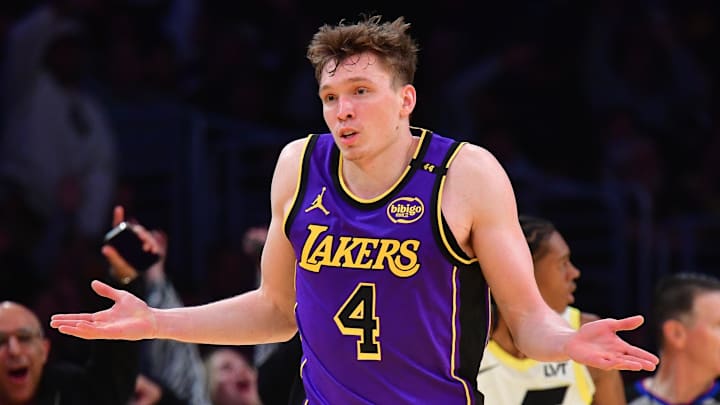 Nov 19, 2024; Los Angeles, California, USA; Los Angeles Lakers guard Dalton Knecht (4) react after scoring a three point basket against the Utah Jazz during the second half at Crypto.com Arena. Mandatory Credit: Gary A. Vasquez-Imagn Images
