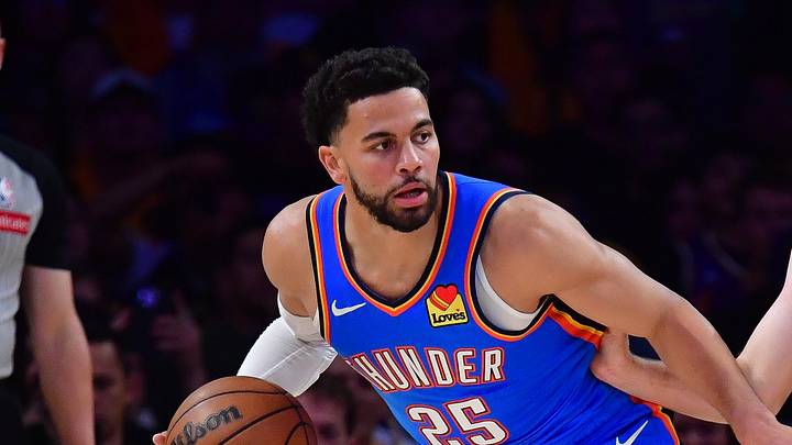 May 11, 2026; Los Angeles, California, USA; Oklahoma City Thunder guard Ajay Mitchell (25) moves the ball against Los Angeles Lakers guard Austin Reaves (15) during the first half in game four of the second round of the 2026 NBA Playoffs at Crypto.com Arena. Mandatory Credit: Gary A. Vasquez-Imagn Images