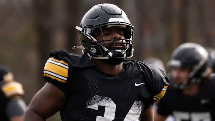 Iowa Hawkeye’s Jay Higgins runs during the team’s practice at Ensworth School in Nashville, Tenn., Friday, Dec. 27, 2024.