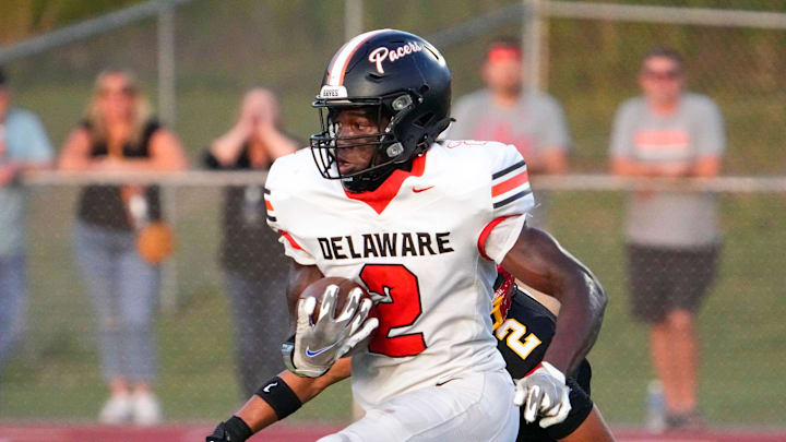 Sep 13, 2024; Sunbury, Ohio, USA; Delaware Hayes Favour Akih (2) runs the ball in for a touchdown against Big Walnut in the first half at Big Walnut High School.