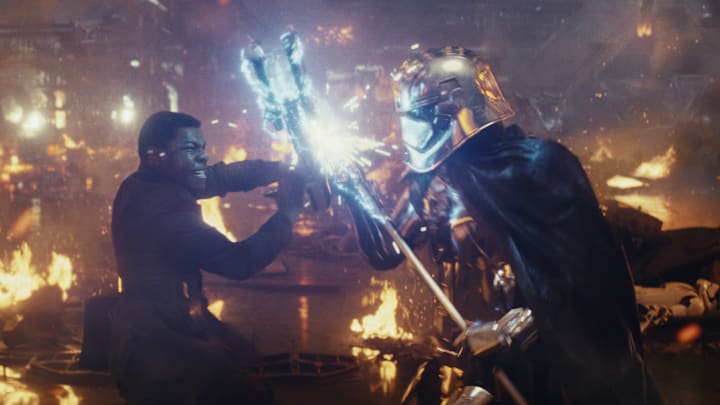 Star Wars: The Last Jedi..L to R: Finn (John Boyega) battling Captain Phasma (Gwendoline Christie)..Photo: Lucasfilm Ltd. ..© 2017 Lucasfilm Ltd. All Rights Reserved.