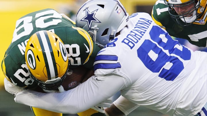 Dallas Cowboys defensive tackle Quinton Bohanna (98) tackles Green Bay Packers running back AJ Dillon in 2022. Dallas Cowboys defensive tackle Quinton Bohanna (98) tackles Green Bay Packers running back AJ Dillon in 2022.