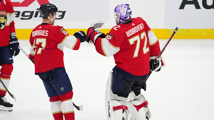 Nov 10, 2023; Sunrise, Florida, USA; Florida Panthers goaltender Sergei Bobrovsky (72) celebrates with center Evan Rodrigues (17) after defeating the Carolina Hurricanes at Amerant Bank Arena. Mandatory Credit: Jasen Vinlove-Imagn Images