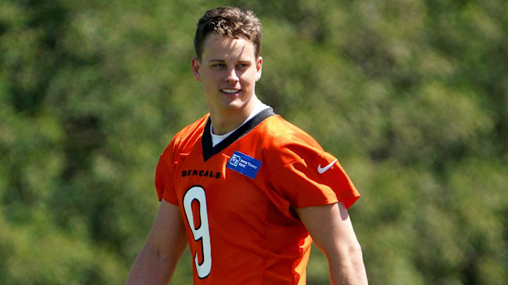 Cincinnati Bengals quarterback Joe Burrow (9) smiles during practice, Tuesday, May 17, 2022, at the Paul Brown Stadium practice fields in Cincinnati.

Cincinnati Bengals Practice May 17 0095