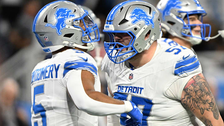 Detroit Lions running back David Montgomery (5) celebrates with center Trystan Colon (57) after a touchdown Detroit Lions running back David Montgomery (5) celebrates with center Trystan Colon (57) after a touchdown