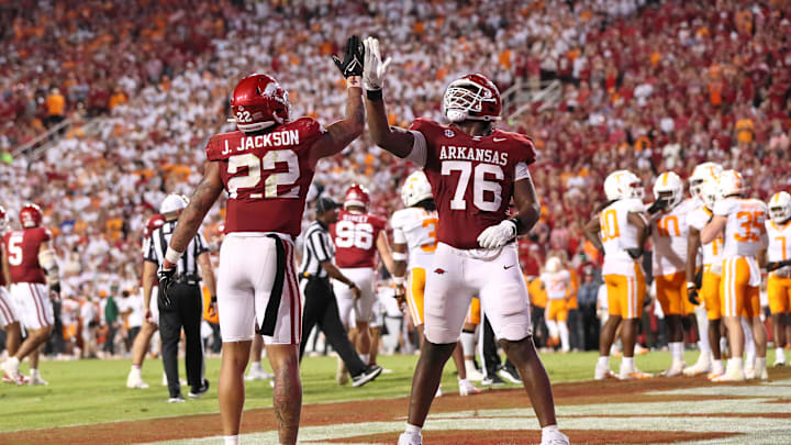 Oct 5, 2024; Fayetteville, Arkansas, USA; Arkansas Razorbacks running back Ja’Quinden Jackson (22) celebrates with offensive lineman E’Marion Harris (76) after scoring in the third quarter against the Tennessee Volunteers at Donald W. Reynolds Razorback Stadium. Arkansas won 19-14. Mandatory Credit: Nelson Chenault-Imagn Images