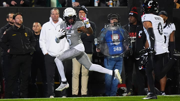 Colorado Buffaloes wide receiver Jimmy Horn Jr. signals a peace sign to Cincinnati Bearcats defensive back Josh Minkins Colorado Buffaloes wide receiver Jimmy Horn Jr. signals a peace sign to Cincinnati Bearcats defensive back Josh Minkins
