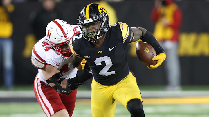 Nov 25, 2022; Iowa City, Iowa, USA; Iowa Hawkeyes running back Kaleb Johnson (2) is tackled from behind by Nebraska Cornhuskers defensive end Garrett Nelson (44) at Kinnick Stadium. Mandatory Credit: Reese Strickland-Imagn Images Nov 25, 2022; Iowa City, Iowa, USA; Iowa Hawkeyes running back Kaleb Johnson (2) is tackled from behind by Nebraska Cornhuskers defensive end Garrett Nelson (44) at Kinnick Stadium. Mandatory Credit: Reese Strickland-Imagn Images