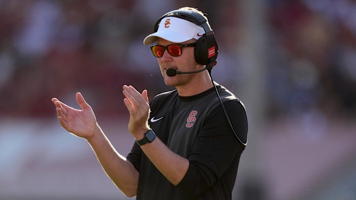 Aug 30, 2025; Los Angeles, California, USA; Southern California Trojans head coach Lincoln Riley watches from the sidelines against the Missouri State Bears in the first half at United Airlines Field at Los Angeles Memorial Coliseum. Mandatory Credit: Kirby Lee-Imagn Images